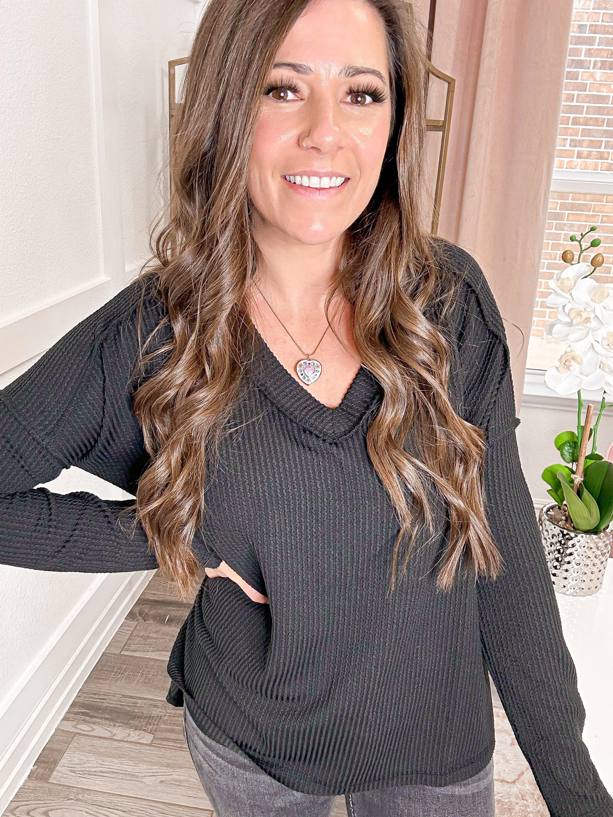 Exposed Edge Long Sleeve Top in Black